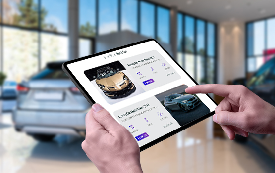 Person holding a tablet in a dealership showroom, using Vehicle Detail Page (VDP) best practices for managing inventory and customer engagement.