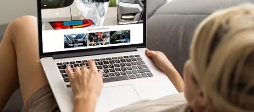 Women using laptops to develop online automotive marketing campaigns to sell cars online